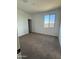 Bedroom with carpeted floor, window and closet at 10984 N 164Th Dr, Surprise, AZ 85388