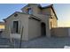 View of home's front entrance with a well-maintained yard with stone at 10984 N 164Th Dr, Surprise, AZ 85388