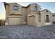 This exterior elevation features a 3-car garage and paver driveway at 10984 N 164Th Dr, Surprise, AZ 85388