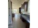 Spacious kitchen featuring dark cabinets, granite countertops, and stainless steel appliances at 10984 N 164Th Dr, Surprise, AZ 85388