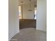 Spacious living room with large opening and chandelier lighting at 10984 N 164Th Dr, Surprise, AZ 85388