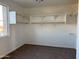 Walk-in closet featuring built-in shelving and ample storage space at 10984 N 164Th Dr, Surprise, AZ 85388