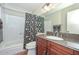 This bathroom features a granite vanity, shower and a tile floor at 1146 E Rovey Ave, Phoenix, AZ 85014