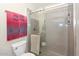 Bathroom featuring a glass shower and tile surround at 1146 E Rovey Ave, Phoenix, AZ 85014
