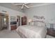 Bedroom with a vaulted ceiling, ceiling fan, and ensuite bathroom at 1146 E Rovey Ave, Phoenix, AZ 85014