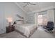 Bedroom featuring vaulted ceilings, a ceiling fan, and sliding glass door at 1146 E Rovey Ave, Phoenix, AZ 85014