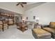 Open concept living room with vaulted ceilings, leading into a dining area and kitchen at 1146 E Rovey Ave, Phoenix, AZ 85014