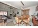 Open floor plan with a living room and dining room area with wooden cabinets and a fireplace at 1146 E Rovey Ave, Phoenix, AZ 85014