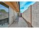 Back patio featuring seating and a privacy wall at 1146 E Rovey Ave, Phoenix, AZ 85014