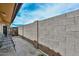 Enclosed patio featuring block walls and a serene outdoor seating area at 1146 E Rovey Ave, Phoenix, AZ 85014