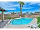 Lounge by the pool in your private oasis with palm trees and clear water at 1146 E Rovey Ave, Phoenix, AZ 85014