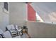 Private balcony features comfortable seating and a view of the surrounding buildings at 123 N Washington St # 16, Chandler, AZ 85225