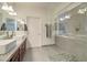 Modern bathroom with granite countertop, double sinks, and a walk-in shower at 123 N Washington St # 16, Chandler, AZ 85225