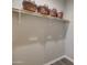Spacious walk-in closet with built-in shelf and decorative baskets for organized storage solutions at 123 N Washington St # 16, Chandler, AZ 85225