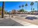 Charming community entrance with brick-paved street, mature landscaping, and inviting gated entrance with pergola at 123 N Washington St # 16, Chandler, AZ 85225