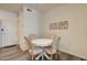 Cozy dining area featuring a round table with four chairs and neutral decor, perfect for intimate meals at 123 N Washington St # 16, Chandler, AZ 85225