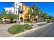 Inviting two-story exterior with vibrant colors, landscaped front, and a charming walkway entrance at 123 N Washington St # 16, Chandler, AZ 85225