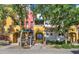 Charming townhouse exterior featuring colorful accents, well-maintained landscaping, and inviting front entrances at 123 N Washington St # 16, Chandler, AZ 85225