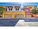 Attached garages of townhomes with stylish exteriors offering convenient parking at 123 N Washington St # 16, Chandler, AZ 85225