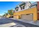 Attached garage with stylish exteriors and landscaping, offering convenient parking at 123 N Washington St # 16, Chandler, AZ 85225