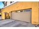 Attached garage with stylish exteriors, offering convenient parking and utilities at 123 N Washington St # 16, Chandler, AZ 85225