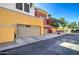 Attached garages of colorful townhomes, offering convenient parking and stylish exteriors at 123 N Washington St # 16, Chandler, AZ 85225
