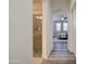 Hallway with neutral colors leading to the primary bedroom suite and secondary bathroom at 123 N Washington St # 16, Chandler, AZ 85225