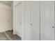 Bright hallway with multiple linen and utility closets for ample storage space at 123 N Washington St # 16, Chandler, AZ 85225