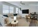 Bright living room featuring a plush sectional sofa, contemporary decor, and ample natural light at 123 N Washington St # 16, Chandler, AZ 85225