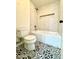 This bathroom has modern tilework, a built in tub, and an updated toilet at 12445 N 21St Ave # 4, Phoenix, AZ 85029