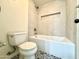 This bathroom has modern tilework, a built in tub, and an updated toilet at 12445 N 21St Ave # 4, Phoenix, AZ 85029