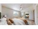 Comfortable bedroom with mirrored closet doors and a ceiling fan at 12445 N 21St Ave # 4, Phoenix, AZ 85029