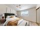 Cozy bedroom with a sloped ceiling, ceiling fan, and a large window at 12445 N 21St Ave # 4, Phoenix, AZ 85029