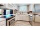 Updated kitchen featuring white cabinets, stainless steel appliances, and modern countertops at 12445 N 21St Ave # 4, Phoenix, AZ 85029
