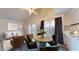 Open concept living room and dining area with a view of the kitchen at 12445 N 21St Ave # 4, Phoenix, AZ 85029