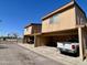 Exterior showing covered parking spaces with vehicles, offering convenient and protected parking for residents at 12445 N 21St Ave # 4, Phoenix, AZ 85029