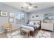 Charming bedroom features a window, chair, dresser, and stylish bed, providing a cozy retreat at 12745 W Calavar Rd, El Mirage, AZ 85335