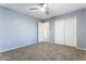 Bedroom featuring a closet and a doorway, providing versatile living space at 12745 W Calavar Rd, El Mirage, AZ 85335