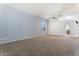 Spacious bedroom boasting vaulted ceilings, plush carpeting and an en-suite bathroom at 12745 W Calavar Rd, El Mirage, AZ 85335