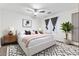 Stylishly furnished bedroom with ceiling fan and modern decor, perfect for restful nights at 12745 W Calavar Rd, El Mirage, AZ 85335