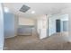 Cozy bonus room with plush carpeting, blue accent wall, and stair access to another level at 12745 W Calavar Rd, El Mirage, AZ 85335