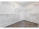 Spacious walk-in closet with ample shelving for organized storage at 12745 W Calavar Rd, El Mirage, AZ 85335