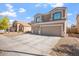 Charming two-story home with a three-car garage, low maintenance landscaping and neutral color palette at 12745 W Calavar Rd, El Mirage, AZ 85335