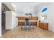 Spacious kitchen features wood cabinets, tiled floors, matching appliances, and a functional center island at 12745 W Calavar Rd, El Mirage, AZ 85335