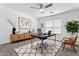 Modern home office featuring natural light, stylish decor, and a comfortable workspace at 12745 W Calavar Rd, El Mirage, AZ 85335