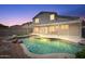 Backyard with a pool, offering an inviting space for relaxation and outdoor enjoyment at 12745 W Calavar Rd, El Mirage, AZ 85335