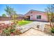 Backyard featuring artificial turf, desert landscaping, and a covered patio for relaxation at 12938 W Mandalay Ln, El Mirage, AZ 85335
