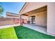 Backyard featuring a combination of artificial turf and desert landscaping for low maintenance at 12938 W Mandalay Ln, El Mirage, AZ 85335