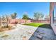 Backyard oasis featuring desert landscaping, artificial turf, and stone pathways for outdoor enjoyment at 12938 W Mandalay Ln, El Mirage, AZ 85335