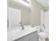 An ample bathroom features a white vanity and mirror, toilet, and a shower-tub combo at 12938 W Mandalay Ln, El Mirage, AZ 85335